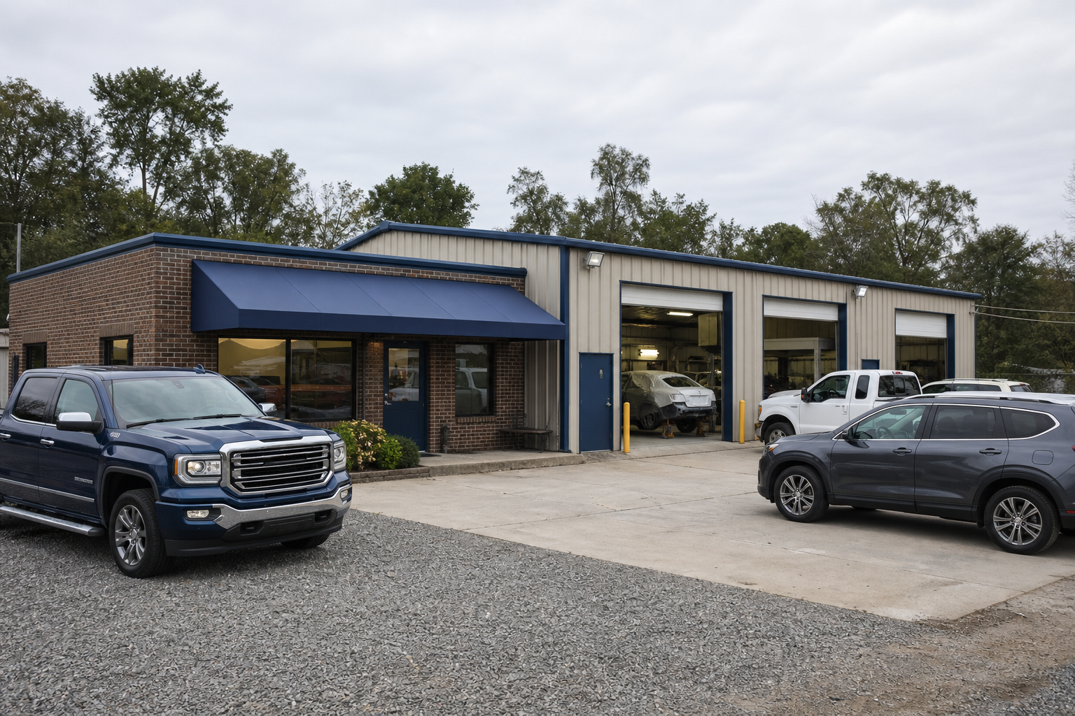 Independent auto body shop exterior with service bays and customer vehicles